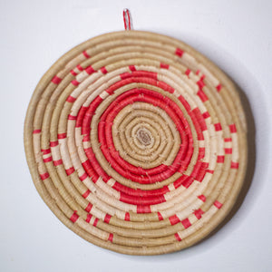 JustOne's red and neutral hanging basket handwoven in Uganda