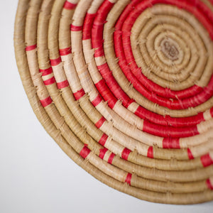 JustOne's red and neutral hanging basket handwoven in Uganda