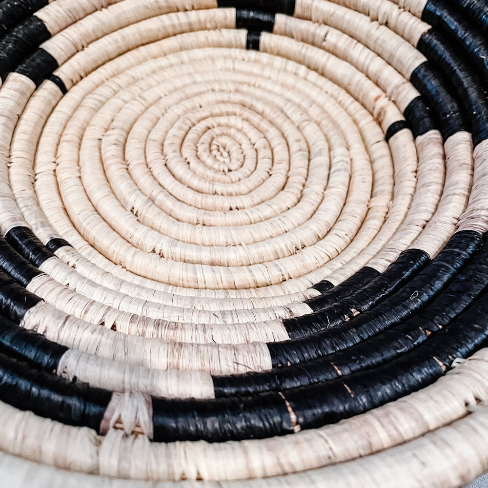 JustOne's tan star basket with black handwoven in Uganda