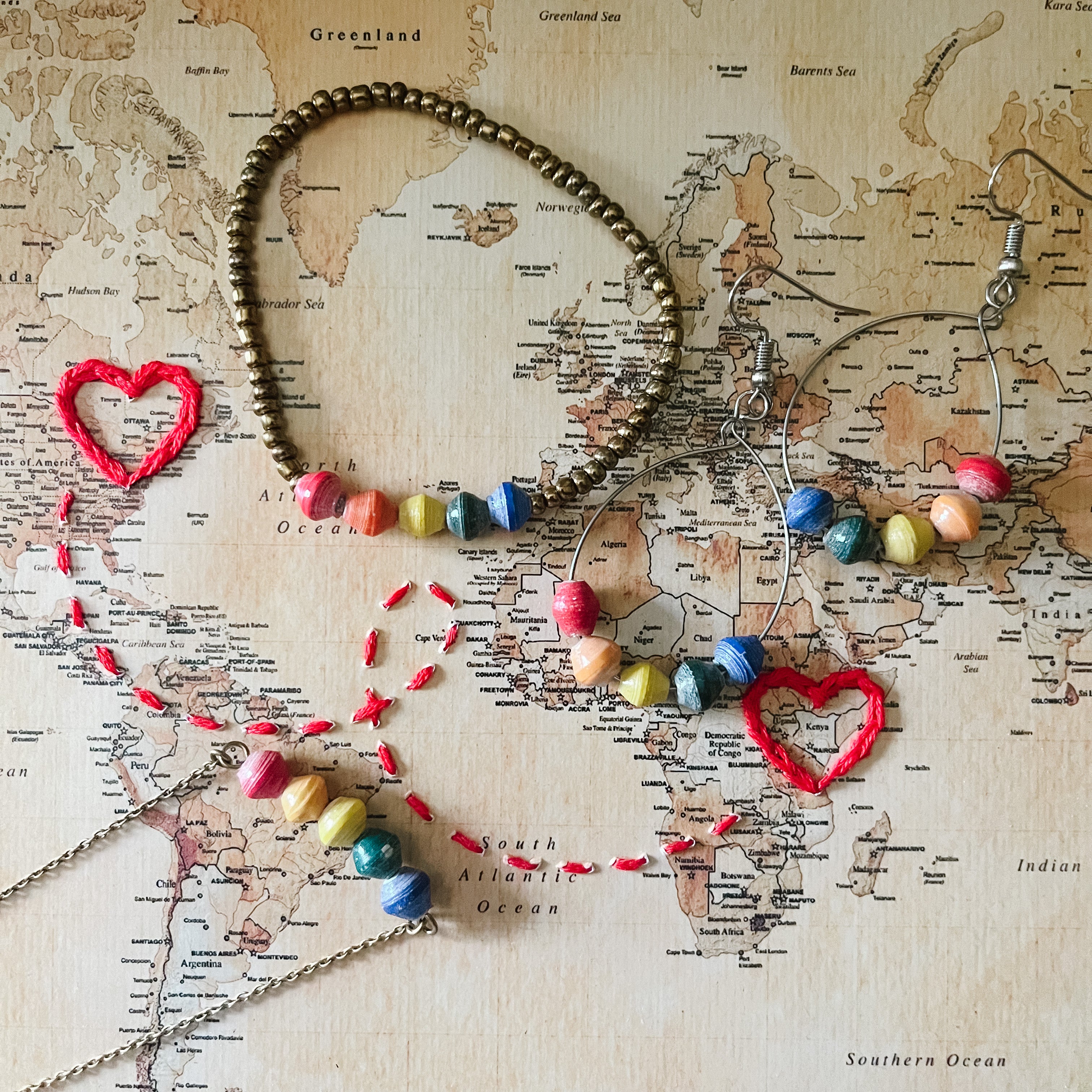 JustOne's thin necklace with five beads to make a rainbow handmade in Uganda