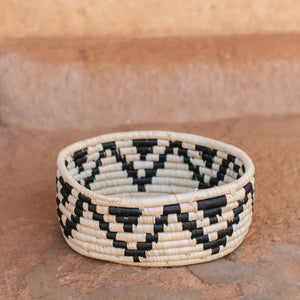 JustOne's deep basket with white and black designs handwoven in Uganda