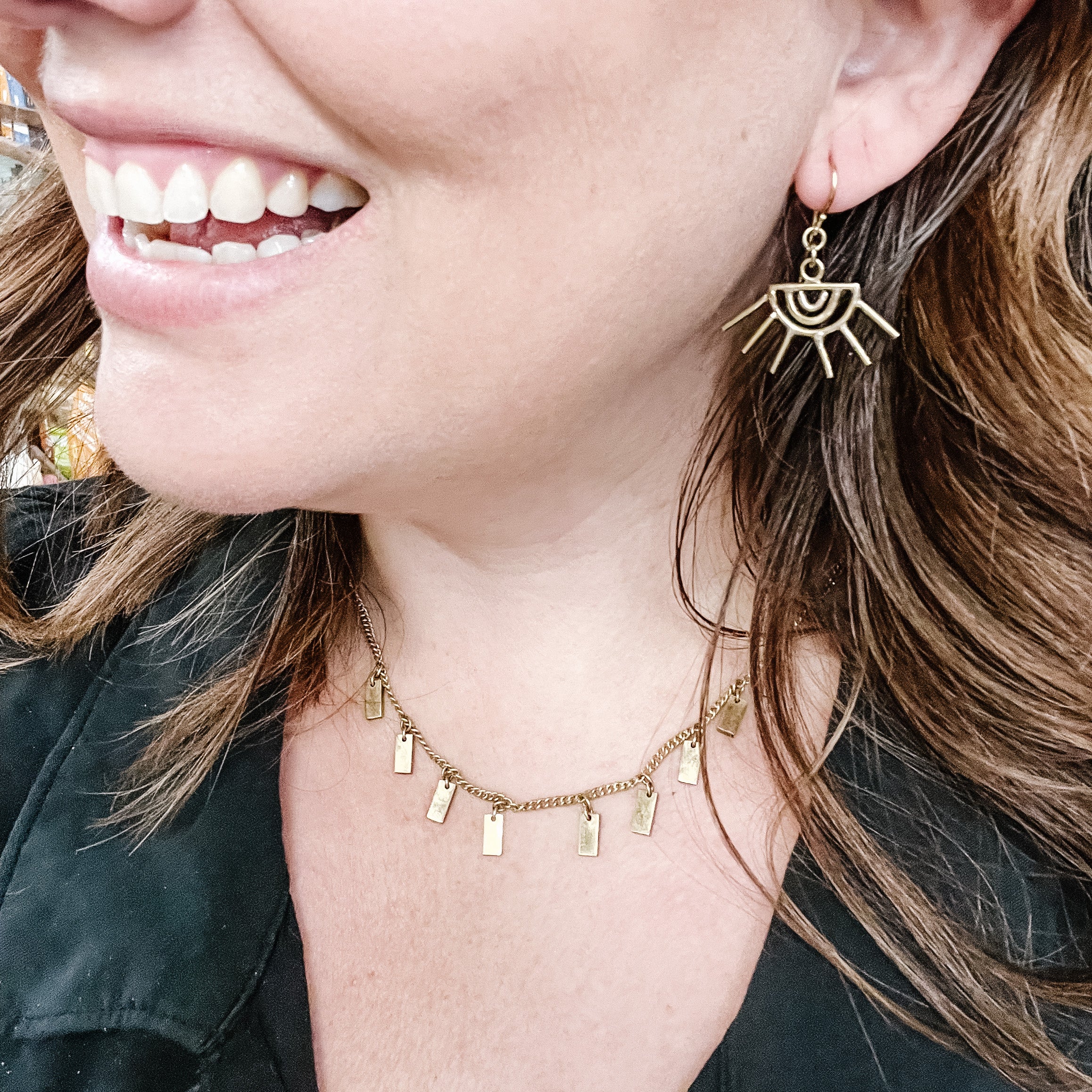 JustOne's brass eye shaped earrings with eyelashes sticking out of the earring, handcrafted in Kenya