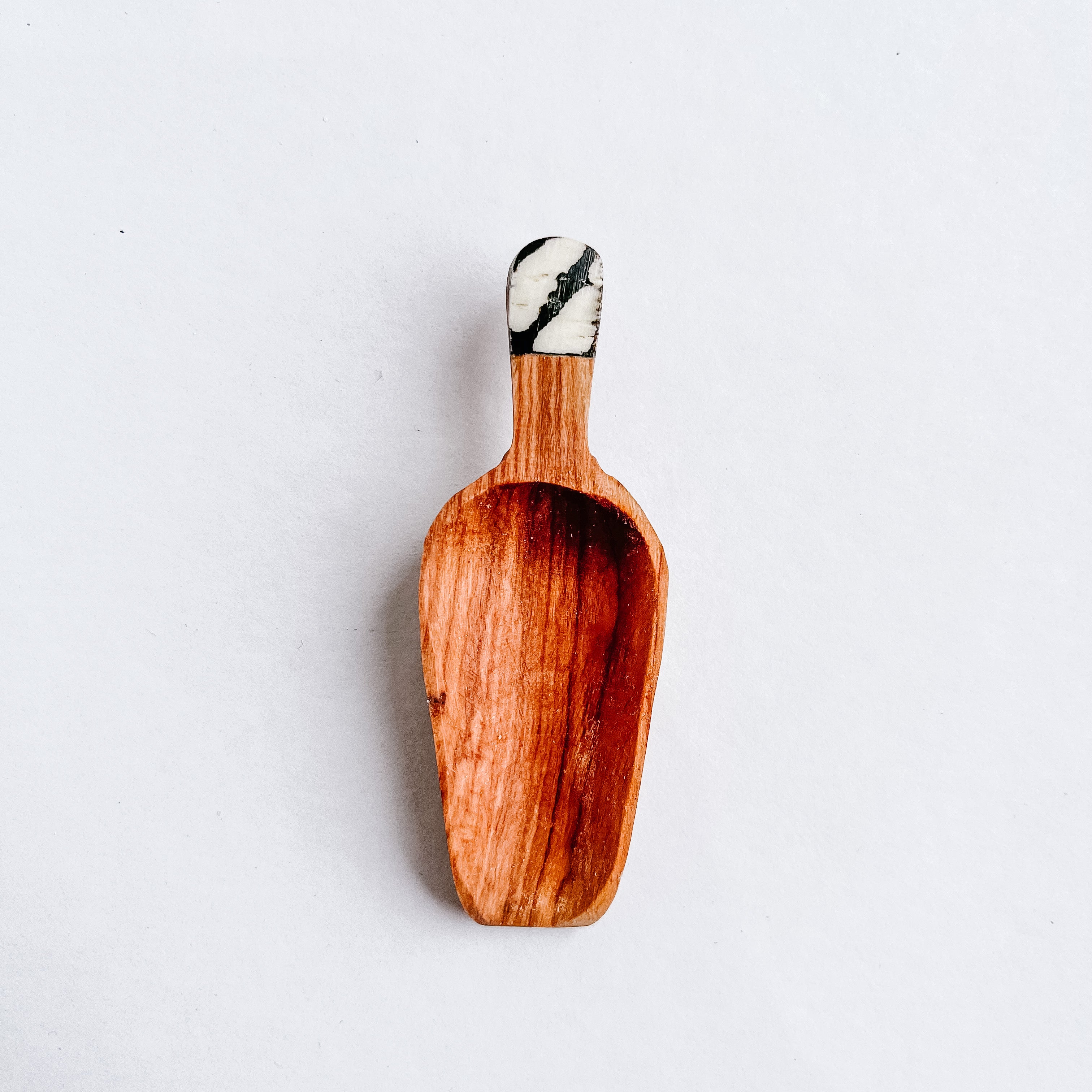 JustOne's four inch wooden scoop with handle made of ethically sourced bone, handcrafted in Kenya
