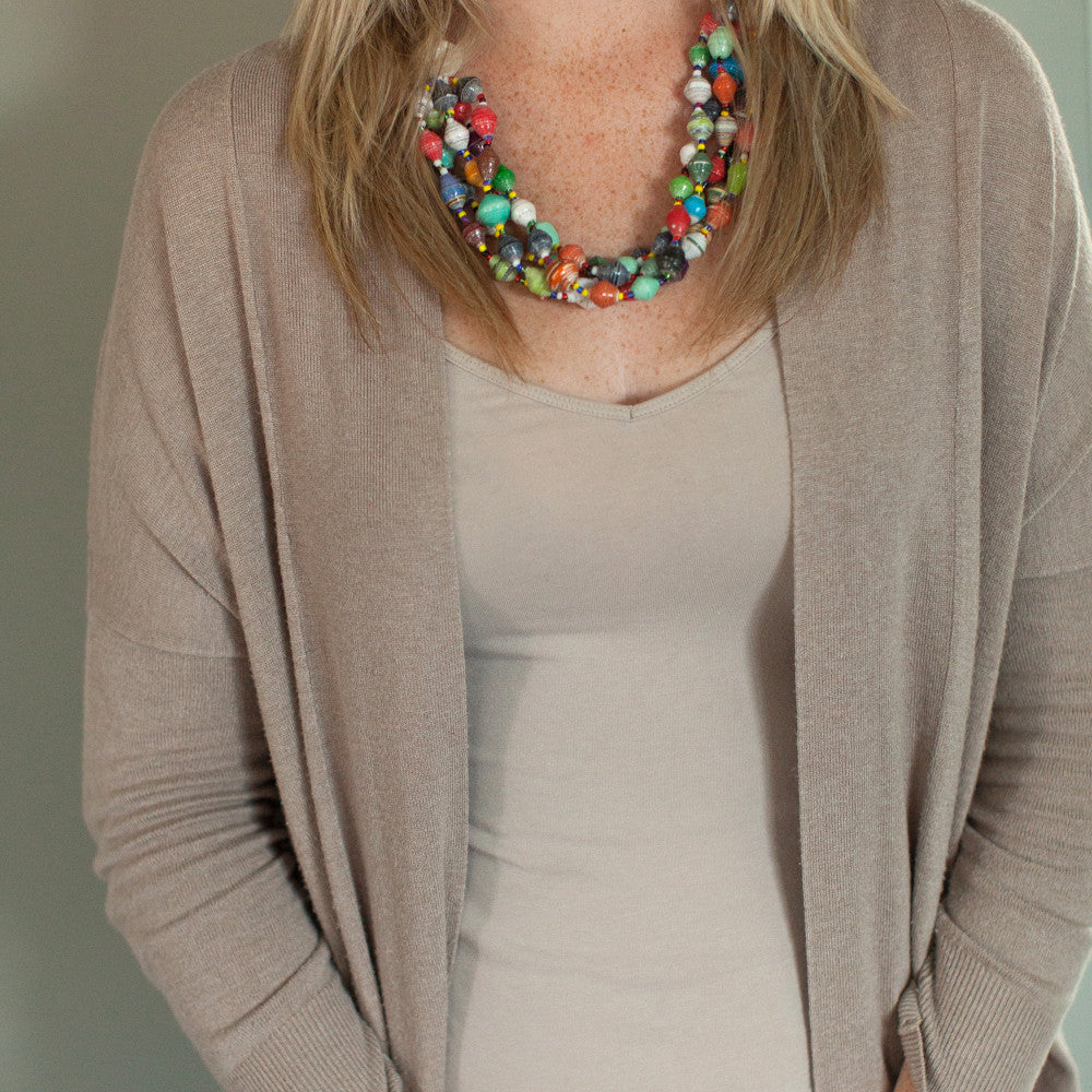 JustOne's chunky necklace with many multi-coloured paper beads, handcrafted by women in Uganda