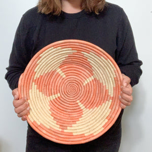 JustOne's pink with tan basket handwoven in Uganda