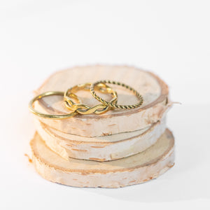 JustOne's brass ring with twisted design, handcrafted in Kenya
