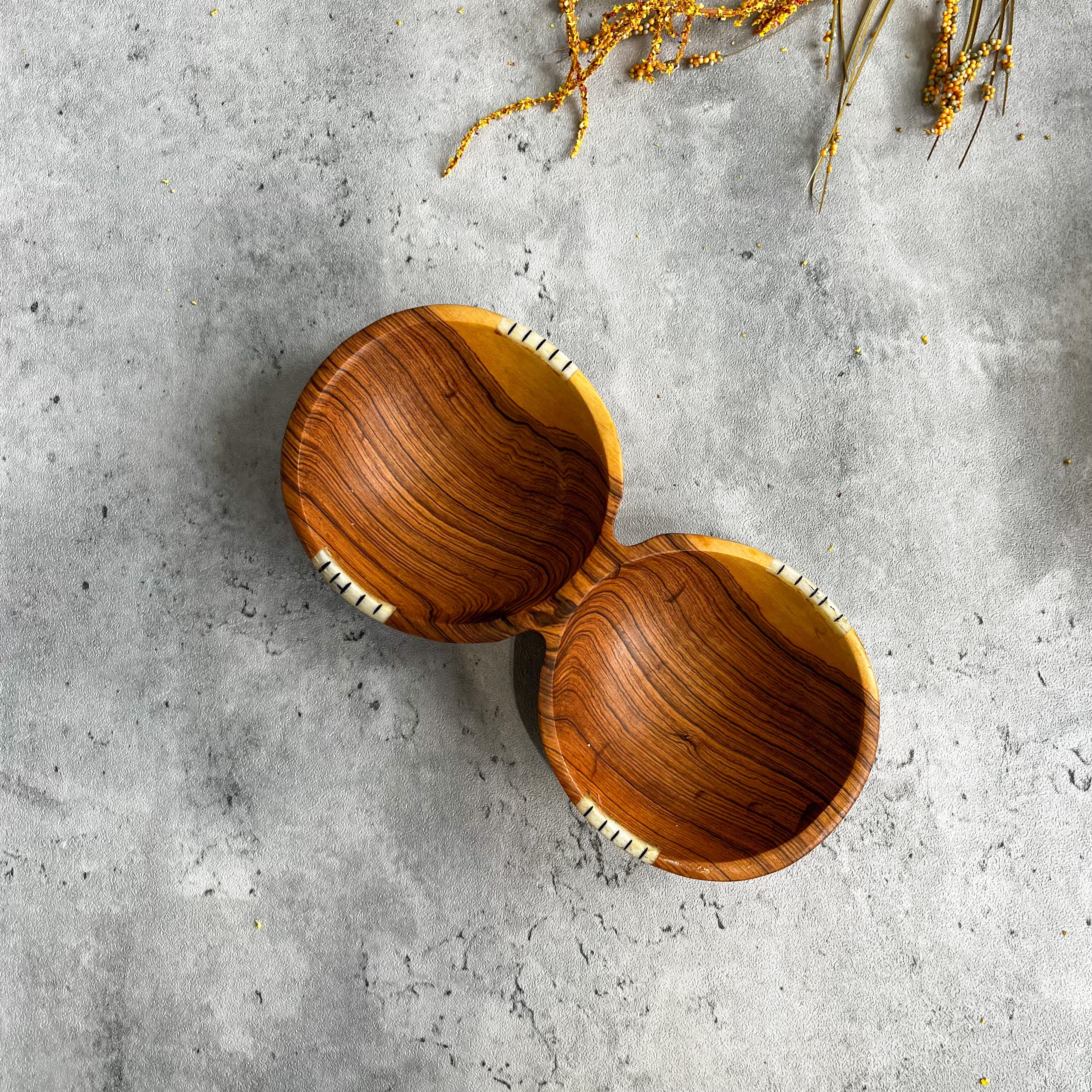JustOne's wooden double bowl that looks like two circular bowls fused together, handmade in Kenya