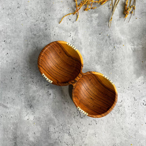 JustOne's wooden double bowl that looks like two circular bowls fused together, handmade in Kenya